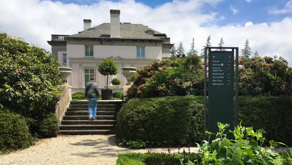 Nemours Estate main building and outdoor freestanding directional sign.