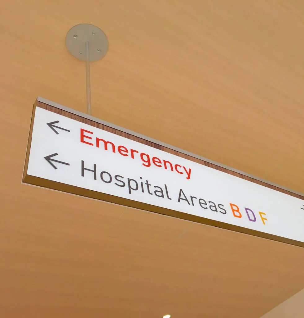 Overhead directory sign for Hospital.