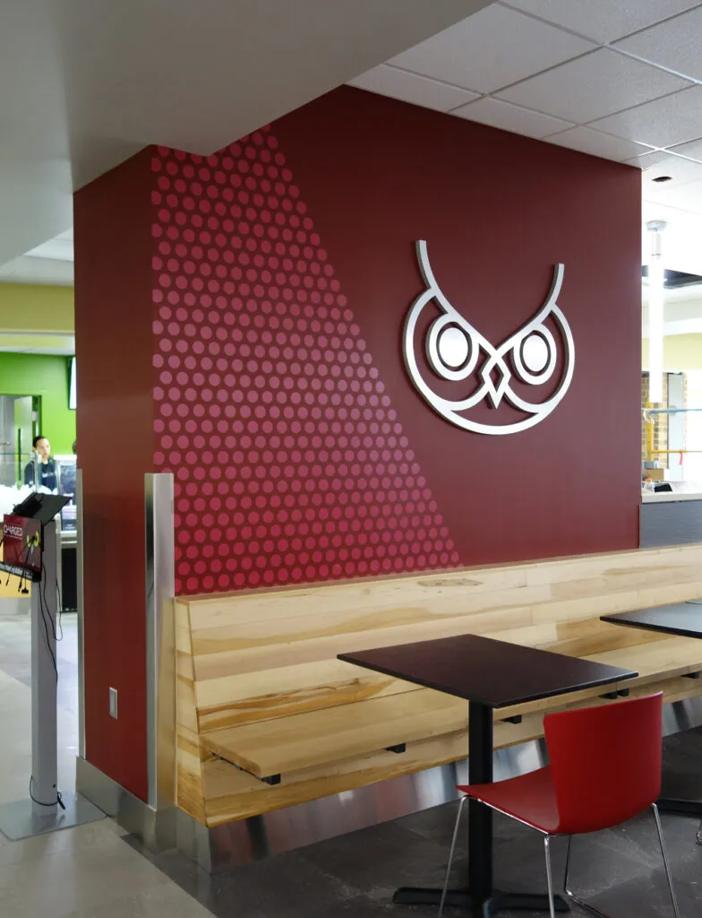 Temple University student center graphic wall treatment and dimensional owl logo.