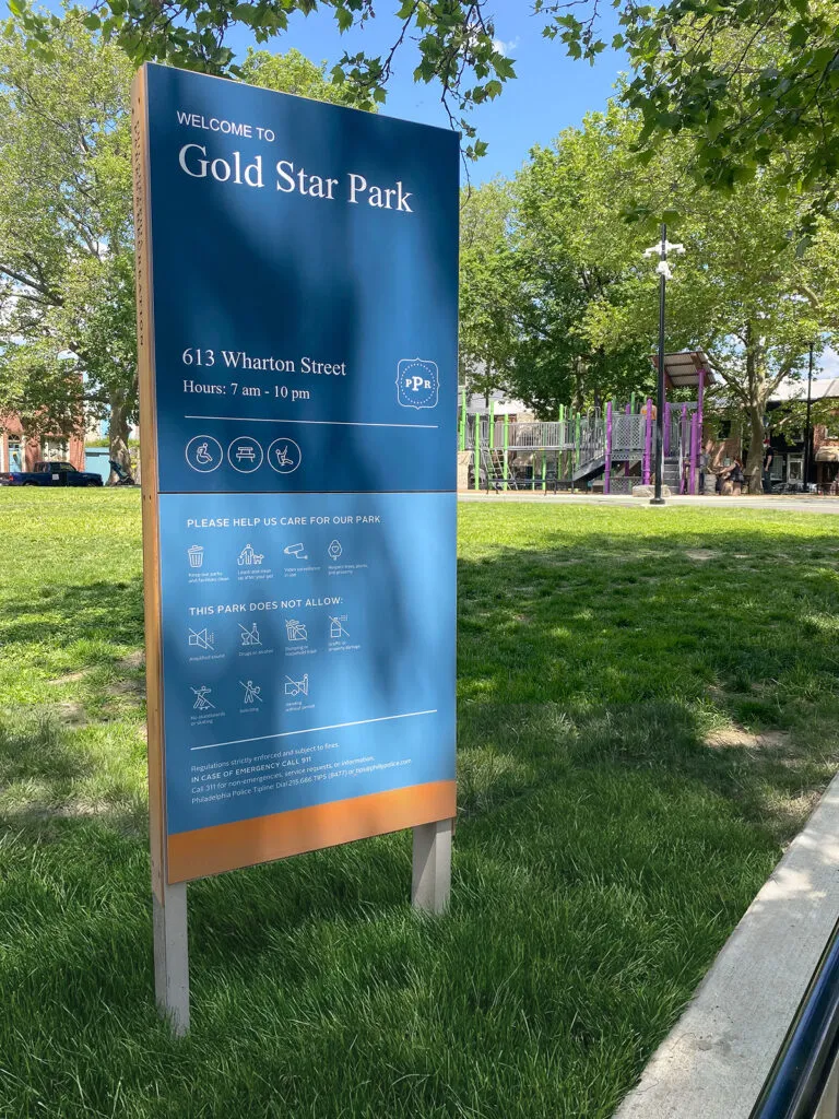 Sign outside Gold Star Park stating park hours and rules