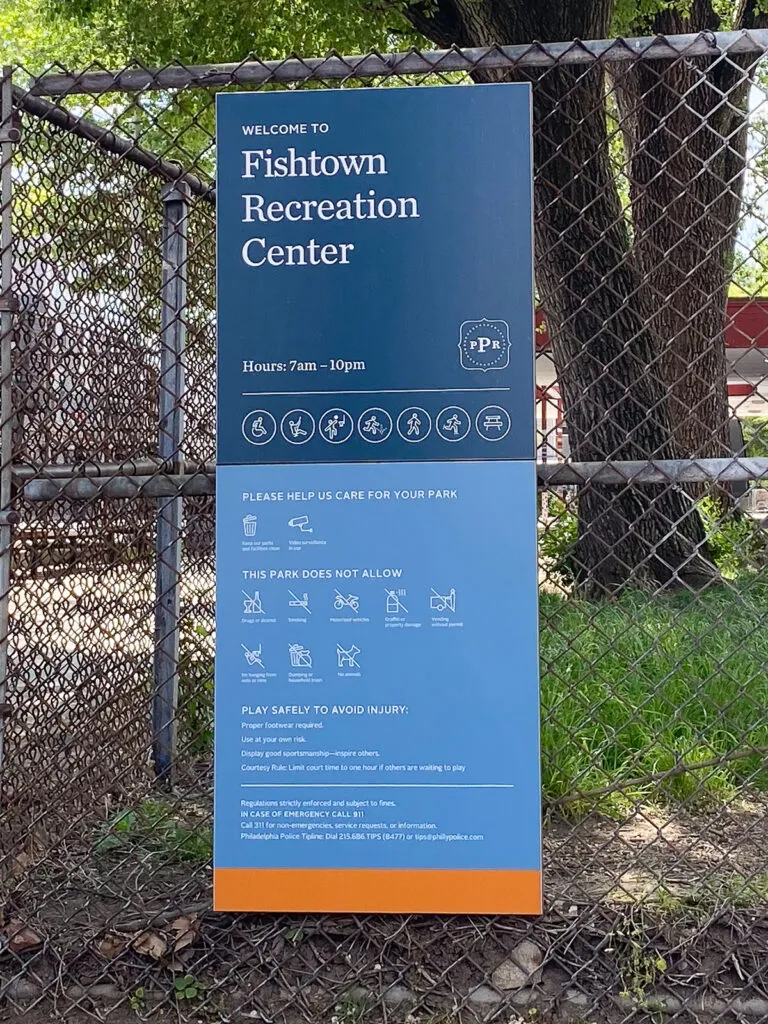 Sign mounted to fence designating the Fishtown Recreation Center