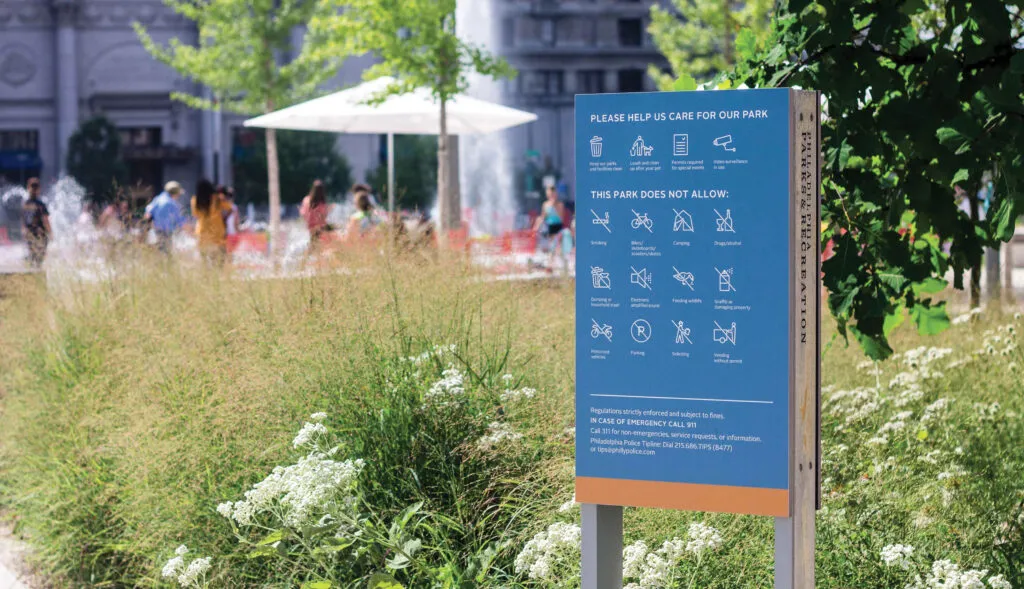 Love Park sign with rules and regulations icons