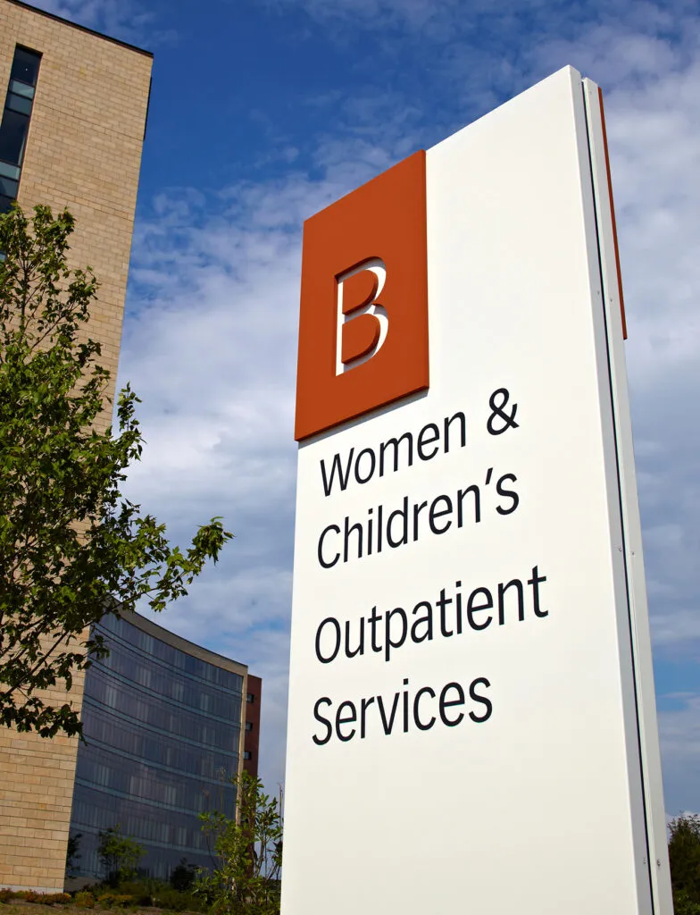 Exterior signage for neighborhood B, women & children's, and outpatient services