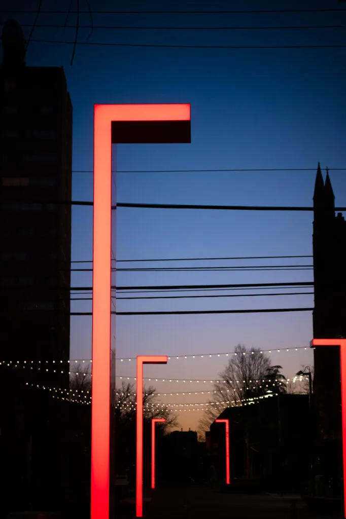 Night shot of pillars with red lighting
