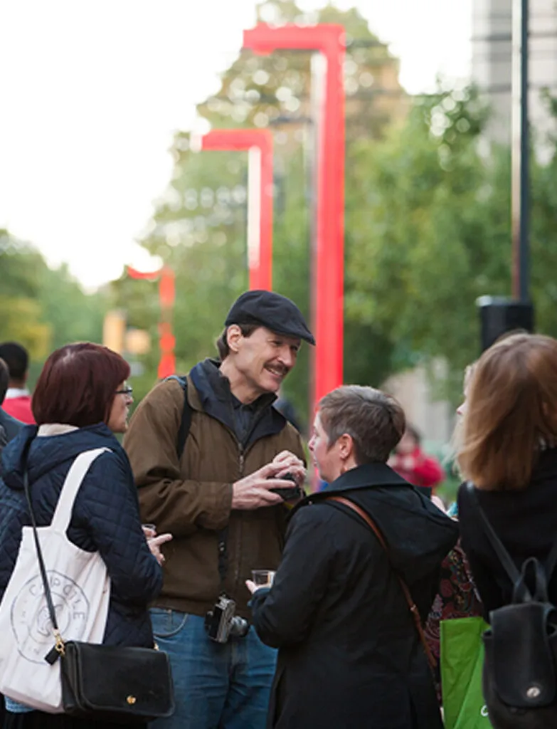People snacking and chatting outdoors