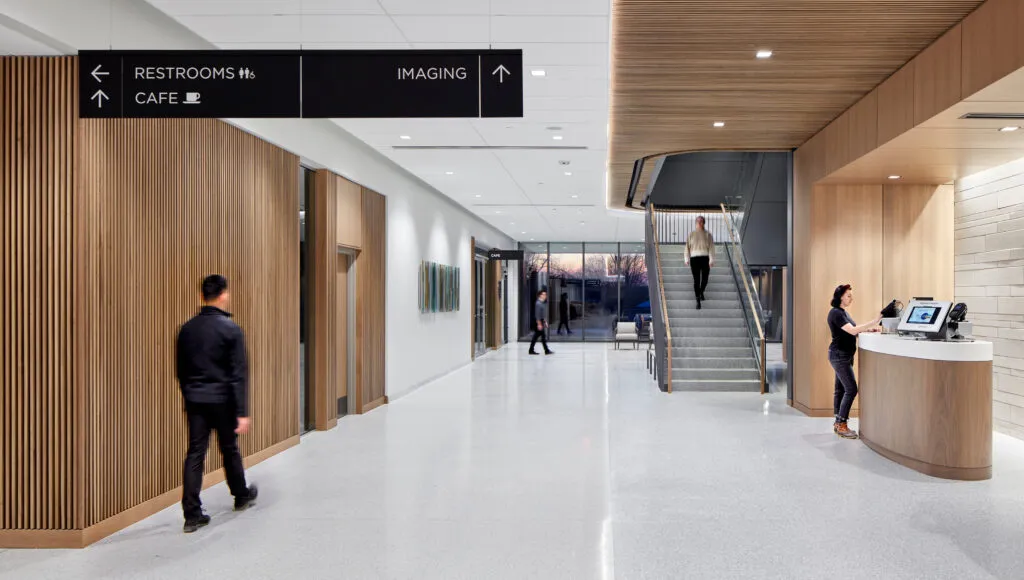 SSMHealth Fish Hatchery hallway with overhead directionals pointing to amenities