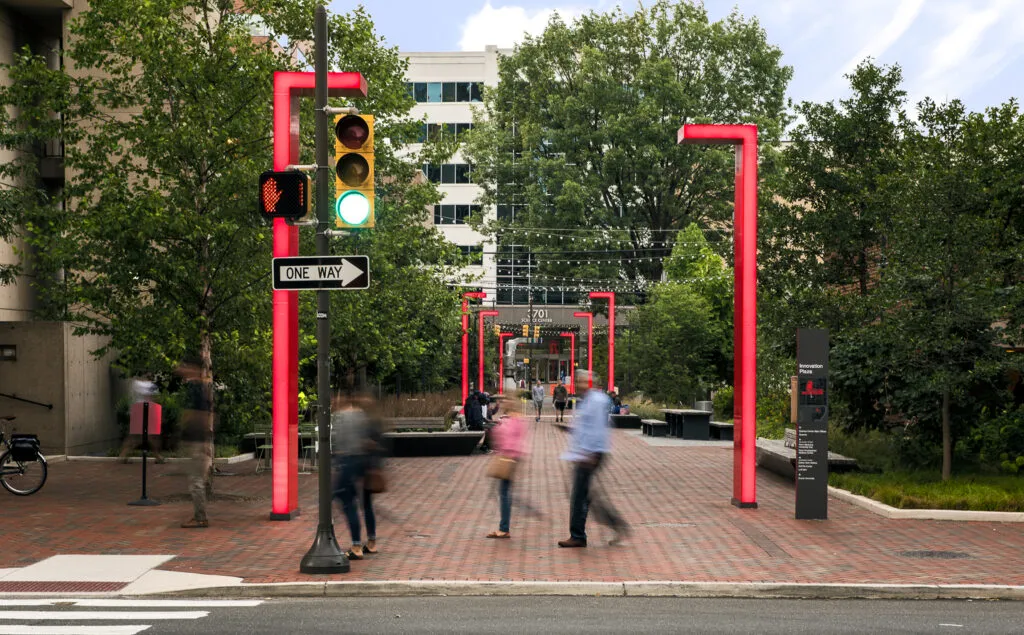 People walking past plaza