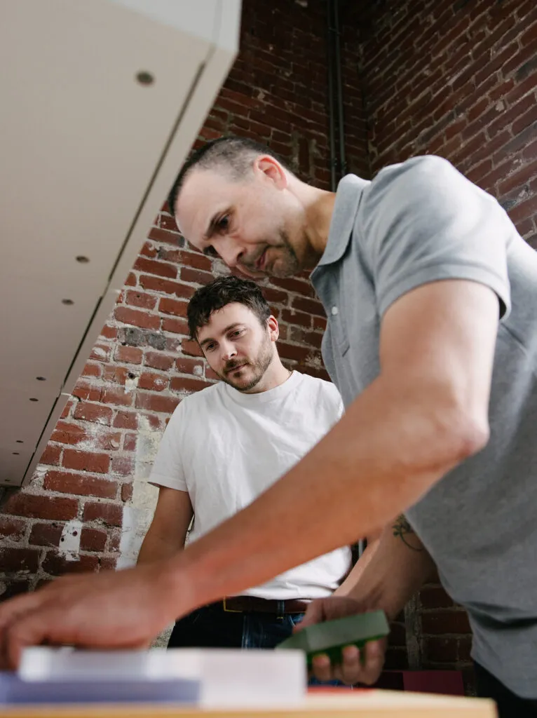 Exit staff looking through material options