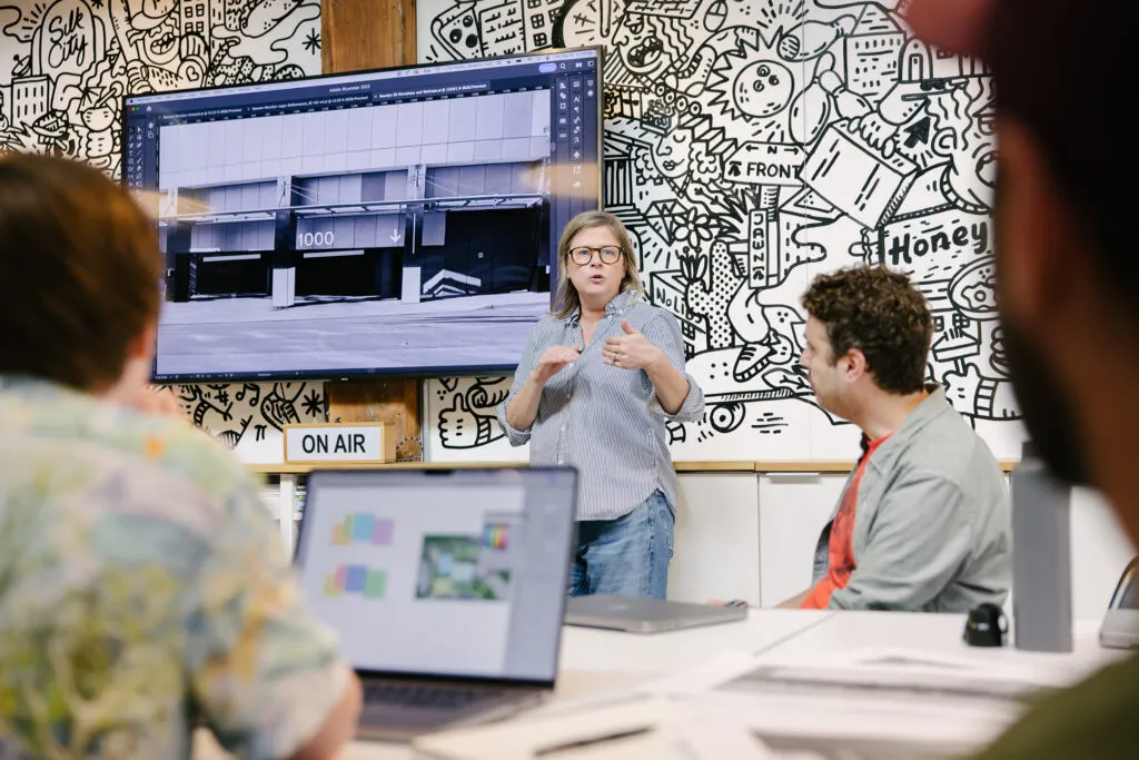 J2 and Exit staff collaborating on a project